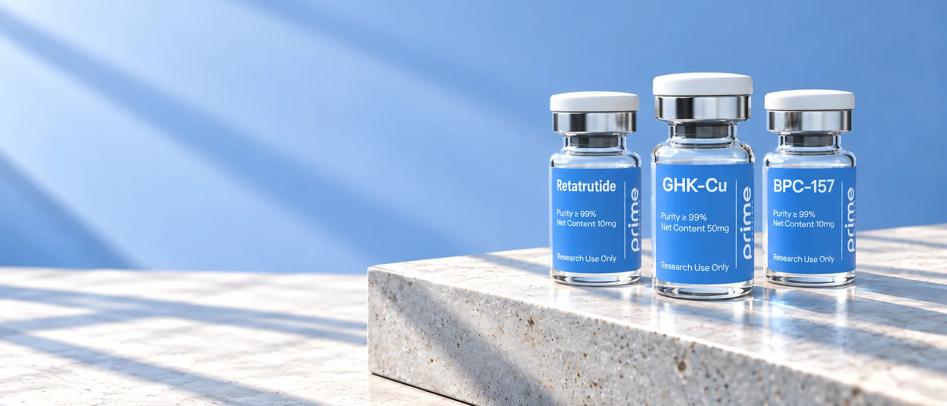 Prime Peptides Retatrutide, GHK-Cu and BPC-157 research vials on a stone plinth